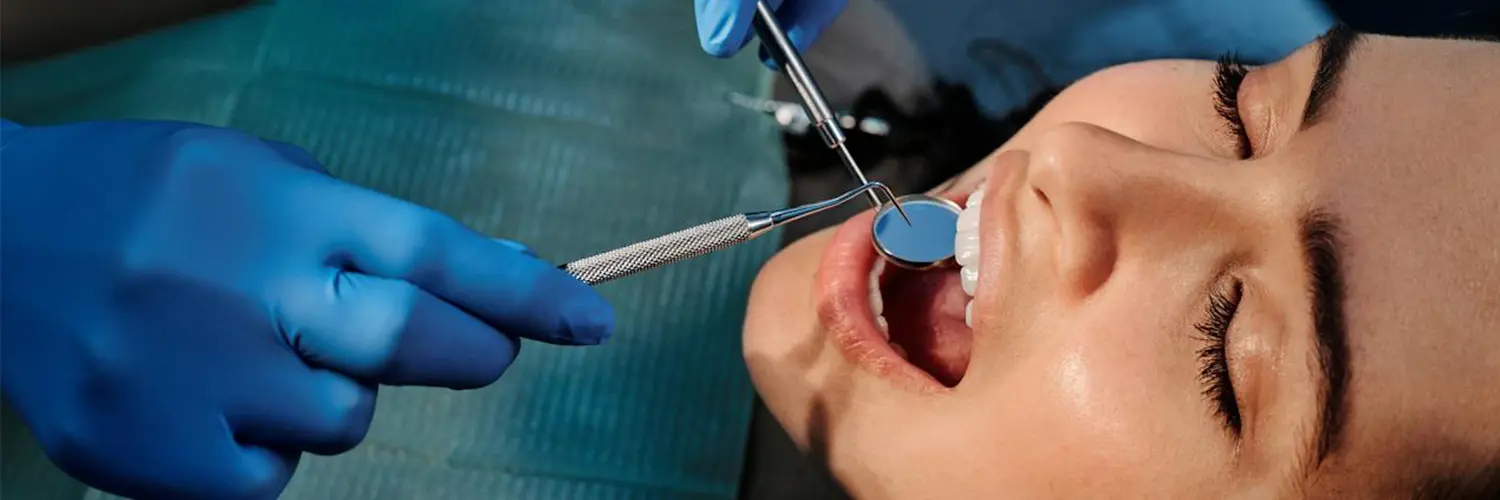 Dentist examining a patient before a dental extraction